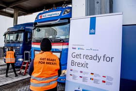 Flyers are distributed, as part of the Get Ready For Brexit campaign, to truck drivers at the terminal of a ferry operator in the port of Rotterdam on December 1, 2020.