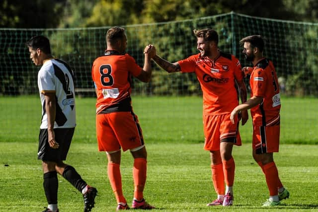 James Cowan, middle, is congratulated after one of his goals at Alresford. Picture by Daniel Haswell.