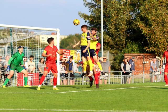 Joe Lea rises to meet a corner against the Met Police. Picture: Tom Phillips