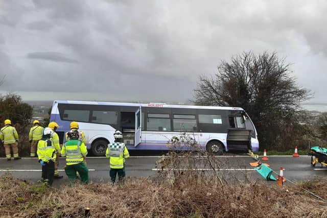 The bus came off the road on James Callaghan Drive. Picture: Scas/Twitter