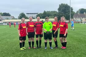 (From L to R) Tara Randall, 3rd, and Shanai Fitzjohn, 5th, with members of Woodbrook United team.