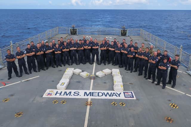 Sailors on HMS Medway stand with their haul of drugs seized from gangs in the Caribbean. Photo: Royal Navy