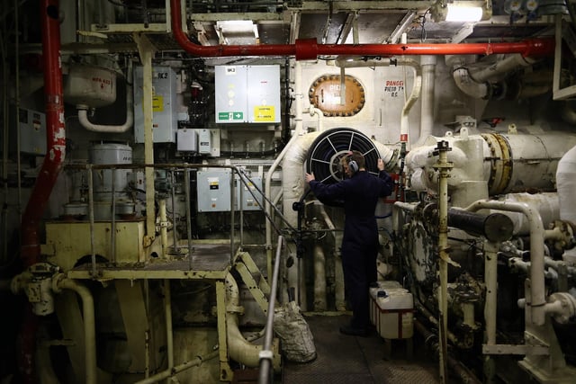 Crew member ETME Turnley seen working in the engine room onboard HMS Illustrious in May 10, 2013. Photo by Dan Kitwood/Getty Images