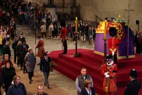 Members of the public view the coffin of Queen Elizabeth II, lying in state on the catafalque in Westminster Hall, at the Palace of Westminster, London, ahead of her funeral on Monday. Picture date: Sunday September 18, 2022. Picture: Adrian Dennis/PA.