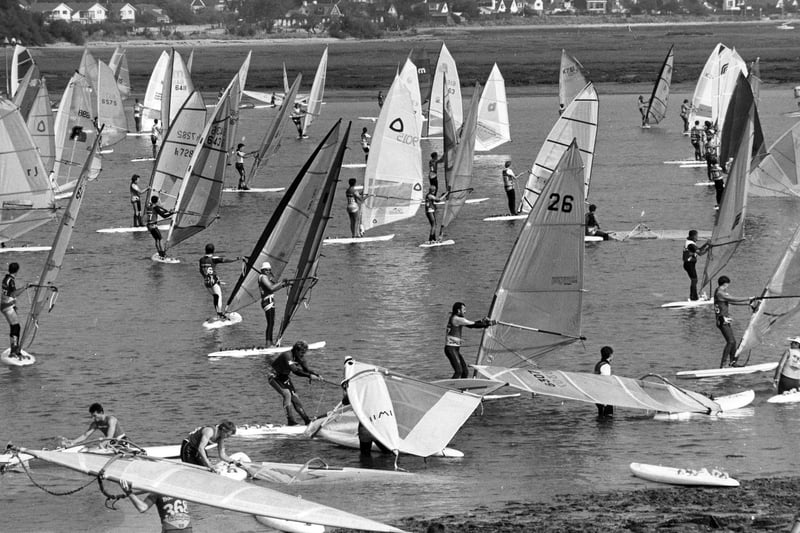 Windsurfers heading to the seas from Northney Marina, Hayling Island, 1988. The News PP5398