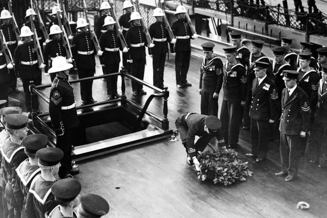 Victory Day At Portsmouth, The 132nd anniversary of Trafalger Day was celebrated with pomp at Portsmouth today. A wreath of laurels was laid upon the deck of H.M.S. victory on the spot where Nelson fell. - The wreath being laid on the spot where Nelson fell, Portsmouth. (Photo by Hulton Archive/Getty Images)