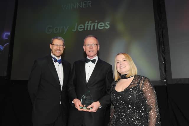 Editor of The News Mark Waldron, left, and Lucy Gleisner from Trethowans present the Lifetime Achievement Award to Gary Jeffries.
Picture: Sarah Standing (210220-8542)