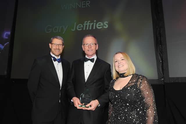 Editor of The News Mark Waldron, left, and Lucy Gleisner from Trethowans present the Lifetime Achievement Award to Gary Jeffries.
Picture: Sarah Standing (210220-8542)