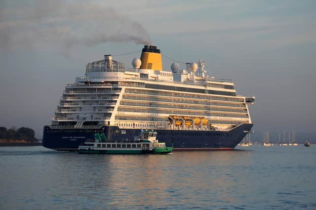 The Saga cruise ship Spirit of Discovery enters Portsmouth Harbour today, dwarfing the Gosport ferry Picture: Sam Stephenson.