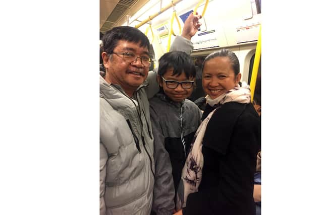 Manuel Vidal, left, with son Troy and wife Emily. Picture: Supplied