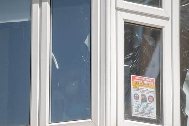 A forensic officer blacks out windows at a property in Leigh Park. Picture: Jordan Pettitt/Solent News & Photo Agency