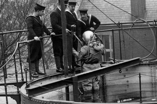 A naval diver descending into a diving tank at Whale Island, circa 1950. Picture: Fox Photos/Getty Images.