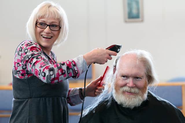 Andy Tolhurst has his head shaved by Rachel Moyce in aid of a planned kitchen refurbishment at Hart Plain Church, Cowplain
Picture: Chris Moorhouse (jpns 290122-02)