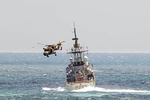 A Wildcat helicopter from RFA Wave Knight passed over HMS Medway during training in the Caribbean. Picture: The Royal Navy