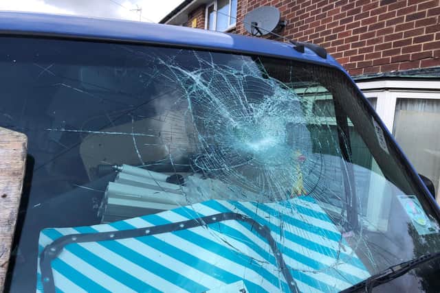 The damage caused by a brick thrown at the pensioner's van.