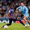 Manchester City's Jack Grealish (right) in action with RB Leipzig's Nordi Mukiele during the UEFA Champions League, Group A match at the Etihad Stadium, Manchester.