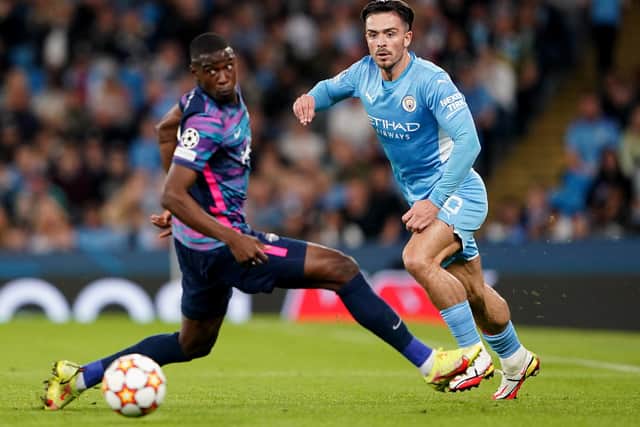 Manchester City's Jack Grealish (right) in action with RB Leipzig's Nordi Mukiele during the UEFA Champions League, Group A match at the Etihad Stadium, Manchester.