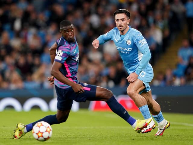 Manchester City's Jack Grealish (right) in action with RB Leipzig's Nordi Mukiele during the UEFA Champions League, Group A match at the Etihad Stadium, Manchester.