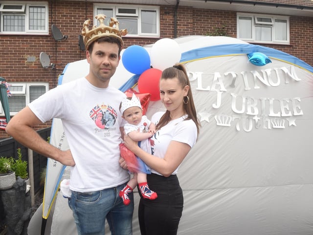 Residents in Dampier Close, Gosport, held a street party on Sunday, June 5, to celebrate The Queen's Platinum Jubilee.
Pictured is: Nathan Fall (36) with his partner Rachel Martin (39) and their daughter Elsie Fall (3 months old).
Picture: Sarah Standing (050622-9543)
