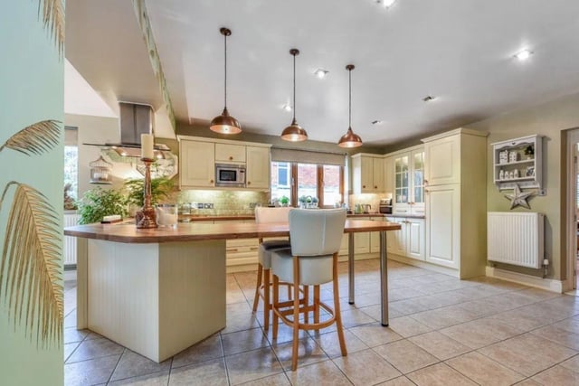 The listing says that this house 'offers deceptively spacious accommodation comprising of five bedrooms, three with en-suite shower rooms, family bathroom, four reception rooms and a feature fitted kitchen/breakfast room.'