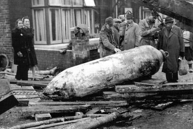 A defused bomb in Torrington Road, Copnor, during or just after the Second World War. What damage it would have caused had it exploded can only be imagined. Of course, local people nicknamed it 'Satan'. Talking to the elderly gent wearing the trilby is a German SS PoW.