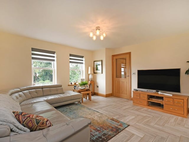 There is a lounge area which looks out onto the front garden.