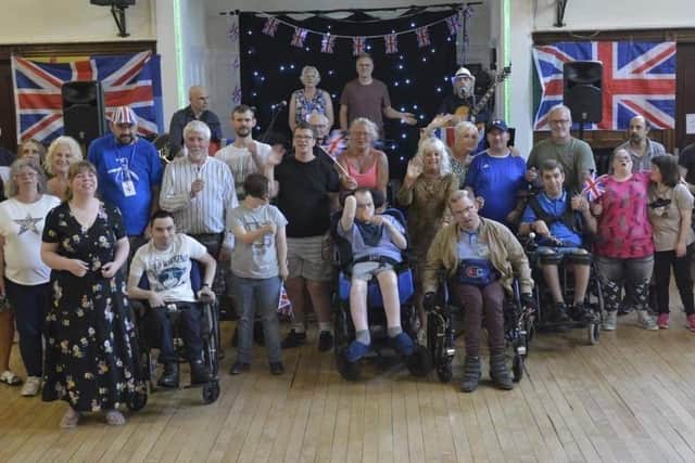 The Bivol Trust service users with carers and staff. 