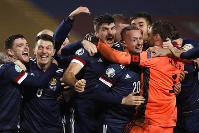 Goalkeeper David Marshall celebrates with his colleagues after his penalty save against Serbia sent Scotland through to their first major football finals since the 1998 World Cup. Photo by Srdjan Stevanovic/Getty Images.