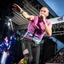 Coldplay performs at Parken Stadium in Copenhagen. Photo by Mads Claus Rasmussen / Ritzau Scanpix / AFP via Getty Images