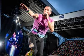 Coldplay performs at Parken Stadium in Copenhagen. Photo by Mads Claus Rasmussen / Ritzau Scanpix / AFP via Getty Images