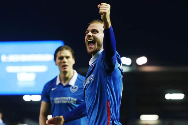 Jack Whatmough celebrates his first goal at Fratton Park with Pompey fans