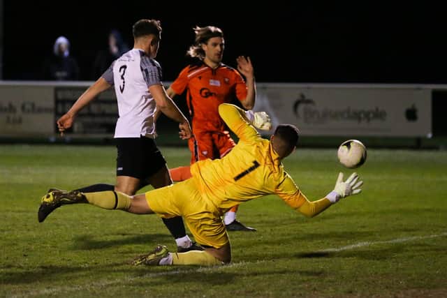Scott Jones scores Portchester's second against Pagham last night. Picture by Nathan Lipsham