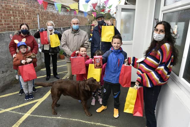 Charis Thomas, right, and members of Eastney Evangelical Church give visiting families Easter egg presents
Picture: Allan Hutchings (030421-3013)