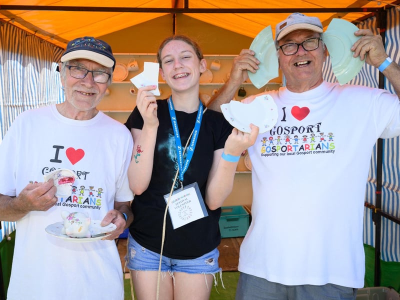 Simon and Lydia Mason with Malcolm Dent of the Gosportarians at their smashing china stall.Picture: Keith Woodland (270721-41)
