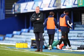 Kenny Jackett watches as Pompey suffered a 2-1 loss to Wigan - their first Fratton Park league defeat for almost months. Picture: Joe Pepler