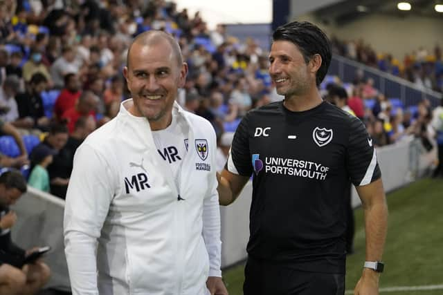 AFC Wimbledon head coach Mark Robinson, left, and Danny Cowley