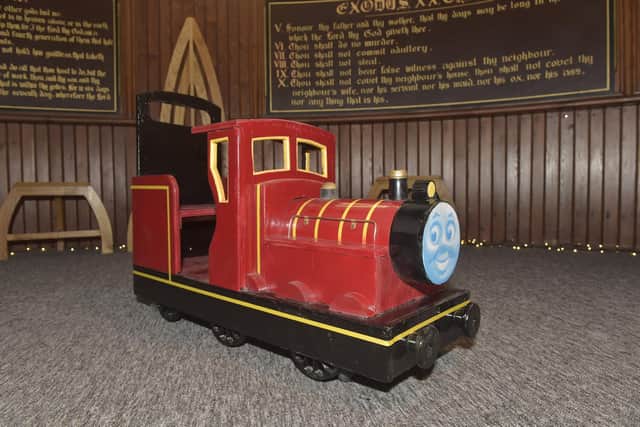 Portsea Men's Shed have been making toy trains and have donated one of them to St Luke's Church in Somerstown, for their Tots in Tow free stay and play group on Tuesday's. Picture: Sarah Standing (130223-9387)