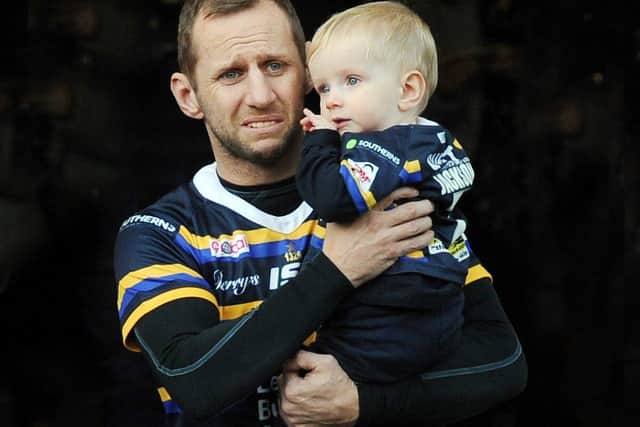 Retired rugby star Rob Burrow pictured with his son Jackson. Photo: Steve Riding