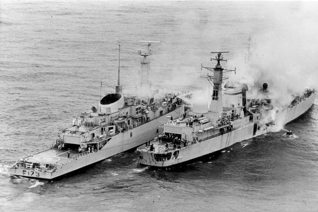 Twenty lives were lost in a strike by an Exocet missile. A Type 21 frigate helps to put out fire on HMS Sheffield...she sank soon after.