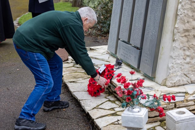 Christopher Judge who travelled down from Newcastle lays a wreath on the memorial at Kingston Cemetery. Picture: Mike Cooter (110324)