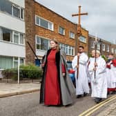The Portsmouth Cross held aloft during the procession along Oyster Street in Old Portsmouth. Picture: Mike Cooter