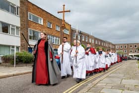 The Portsmouth Cross held aloft during the procession along Oyster Street in Old Portsmouth. Picture: Mike Cooter