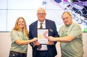 Kate Turnbull and Colin Fielder receiving the award