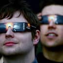 Members of the public are advised to use protective glasses to look into the sky at a partial solar eclipse  (Photo by Jeff J Mitchell/Getty Images)