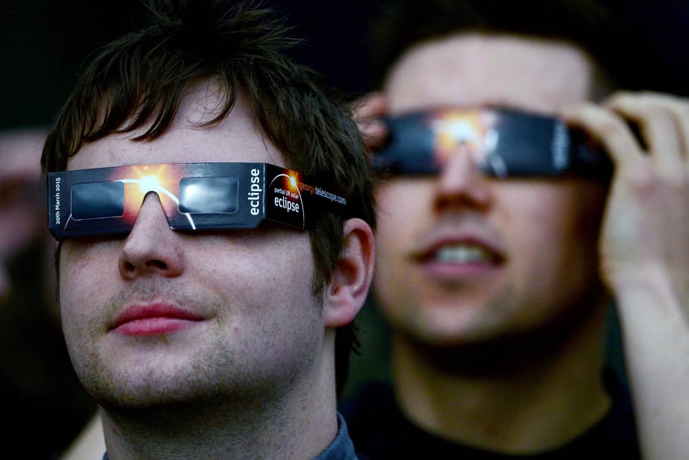 Members of the public are advised to use protective glasses to look into the sky at a partial solar eclipse  (Photo by Jeff J Mitchell/Getty Images)