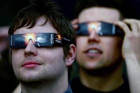Members of the public are advised to use protective glasses to look into the sky at a partial solar eclipse  (Photo by Jeff J Mitchell/Getty Images)
