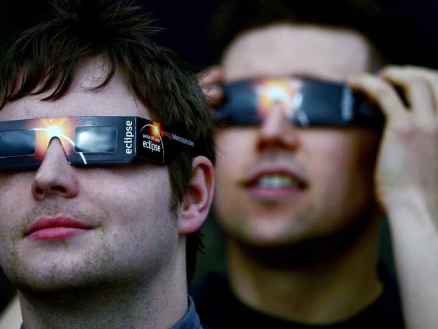 Members of the public are advised to use protective glasses to look into the sky at a partial solar eclipse  (Photo by Jeff J Mitchell/Getty Images)
