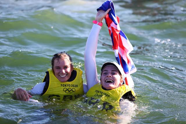 Hannah Mills, left, and Eilidh McIntyre of Team Great Britain celebrate in the water following the Women's 470 class medal race Picture: Clive Mason/Getty Images