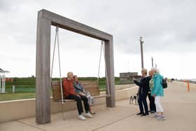 Local residents enjoy the new swing chairs along the promenadePicture: Habibur Rahman