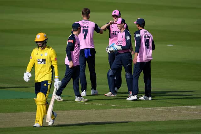 Tom Helm celebrates with teammates after dismissing Hampshire skipper James Vince for just two at Lord's. Photo by Alex Davidson/Getty Images.